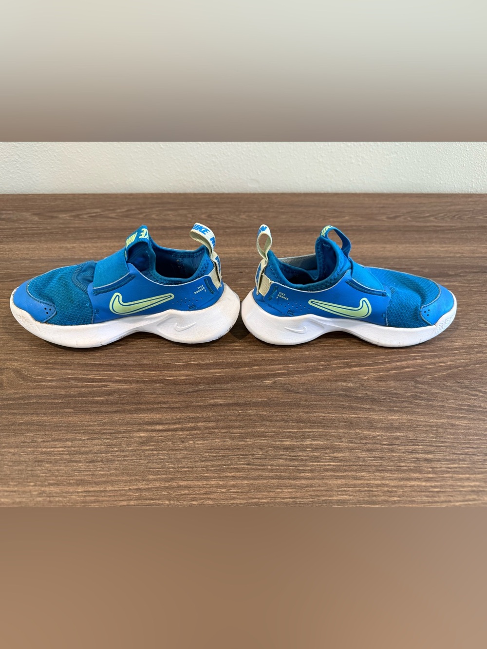 Nike Kids Blue Slip-On Sneakers with Lime Swoosh Accent